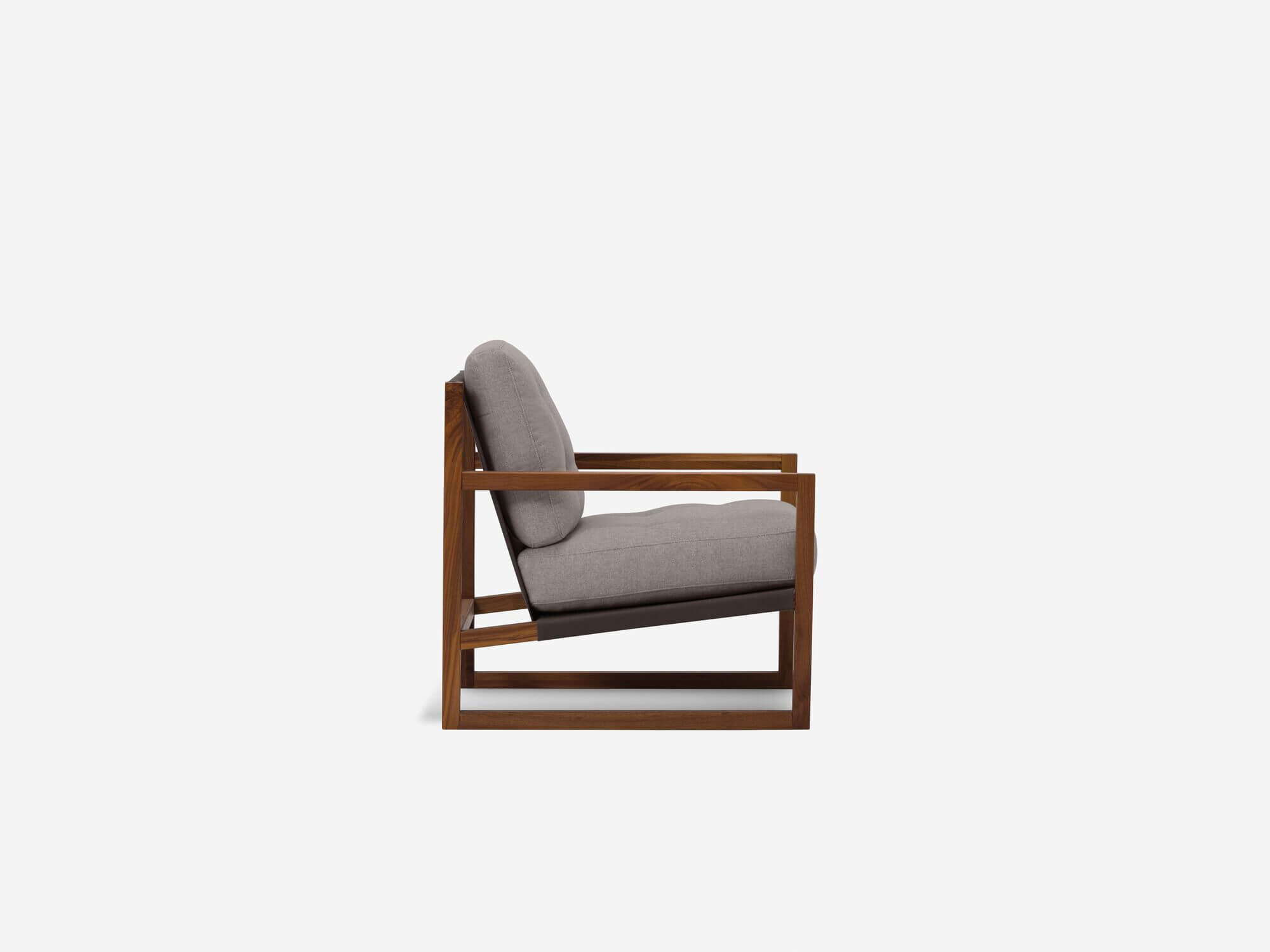 Side view of grey and walnut tufted lounge chair